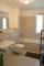 REAL HOUSE: Exclusive Eigentumswohnung im Wohnquartier PARK LINNÈ!!! - Bad mit hellen Fliesen